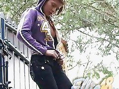 Tanned handsome teenage brunette stripping jeans outdoor