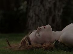 Redhead tease on the grass