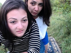 Two naughty teens engage in lesbian action in the outdoors