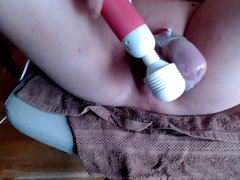 Sissy teasing his caged cock with hitachi wand