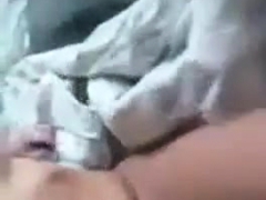 Girl strips and fingers her pussy