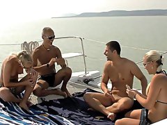 Bitches share and swap partners in outdoor boat XXX