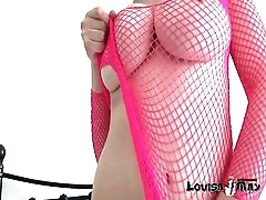 Pink fishnet lingerie is sexy on busty babe